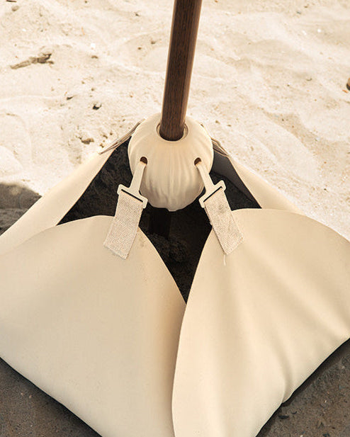 Close-up of the Blossom Base filled with sand on the beach 